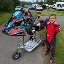 Seven-year-old Nottingham karter Cruz Rodgers celebrates E-Plate win — Nottingham news photo